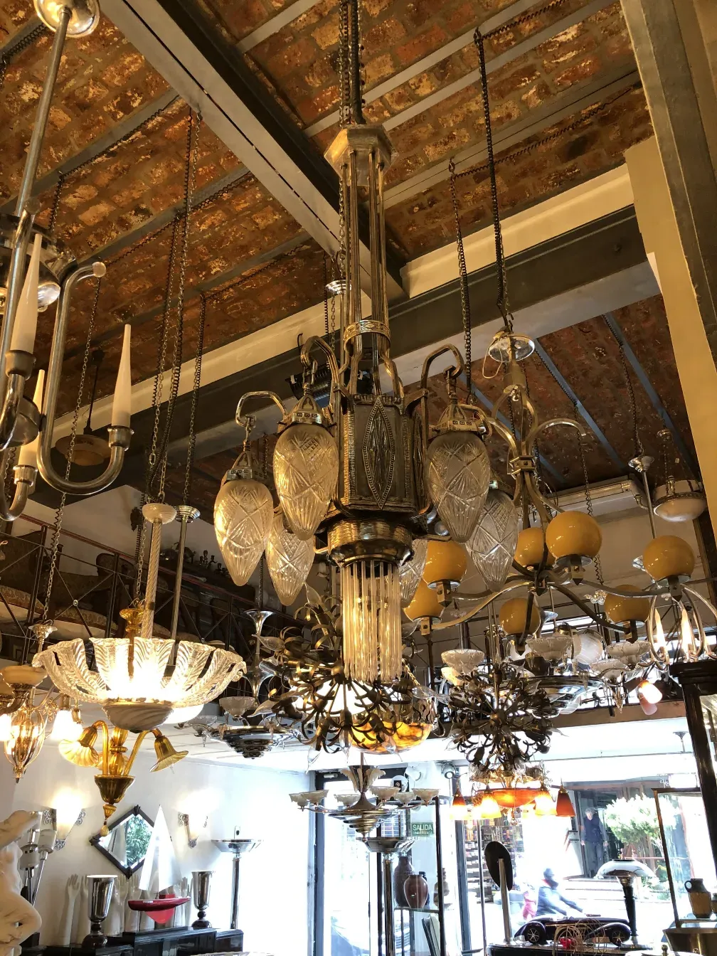 Antique hanging lamp with bright lights and flower decorations.
