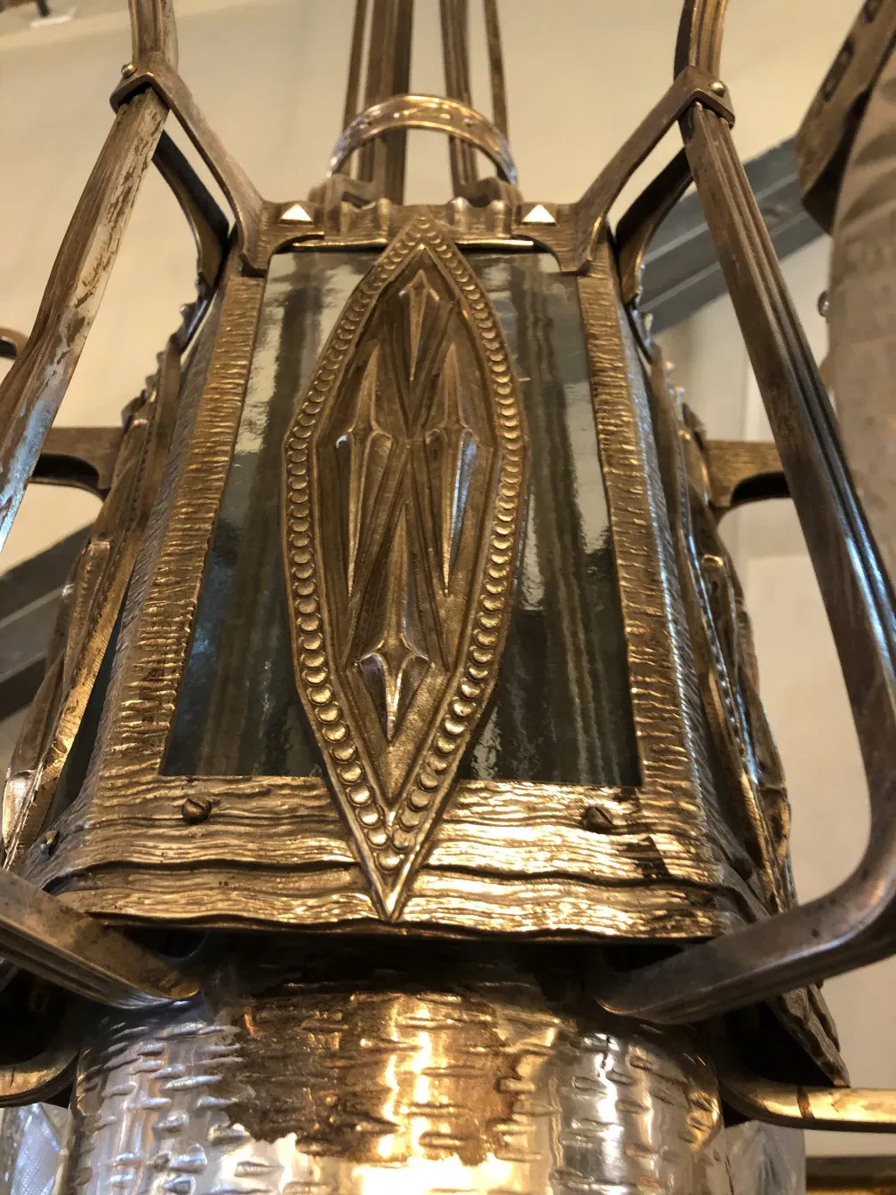 Antique hanging lamp with ornate design, enhancing the decor.