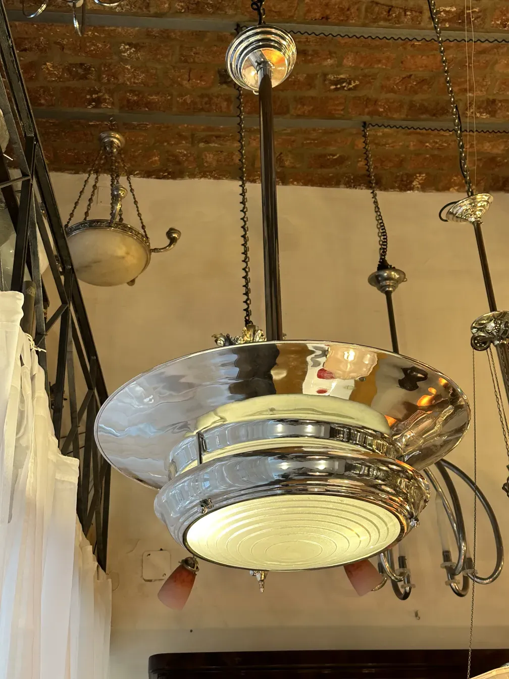 Antique hanging lamp with bright illumination in a cozy setting.