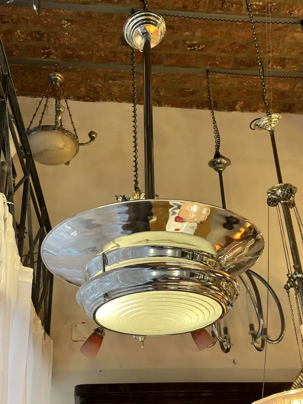 Shiny antique hanging lamp, classic style, brick background