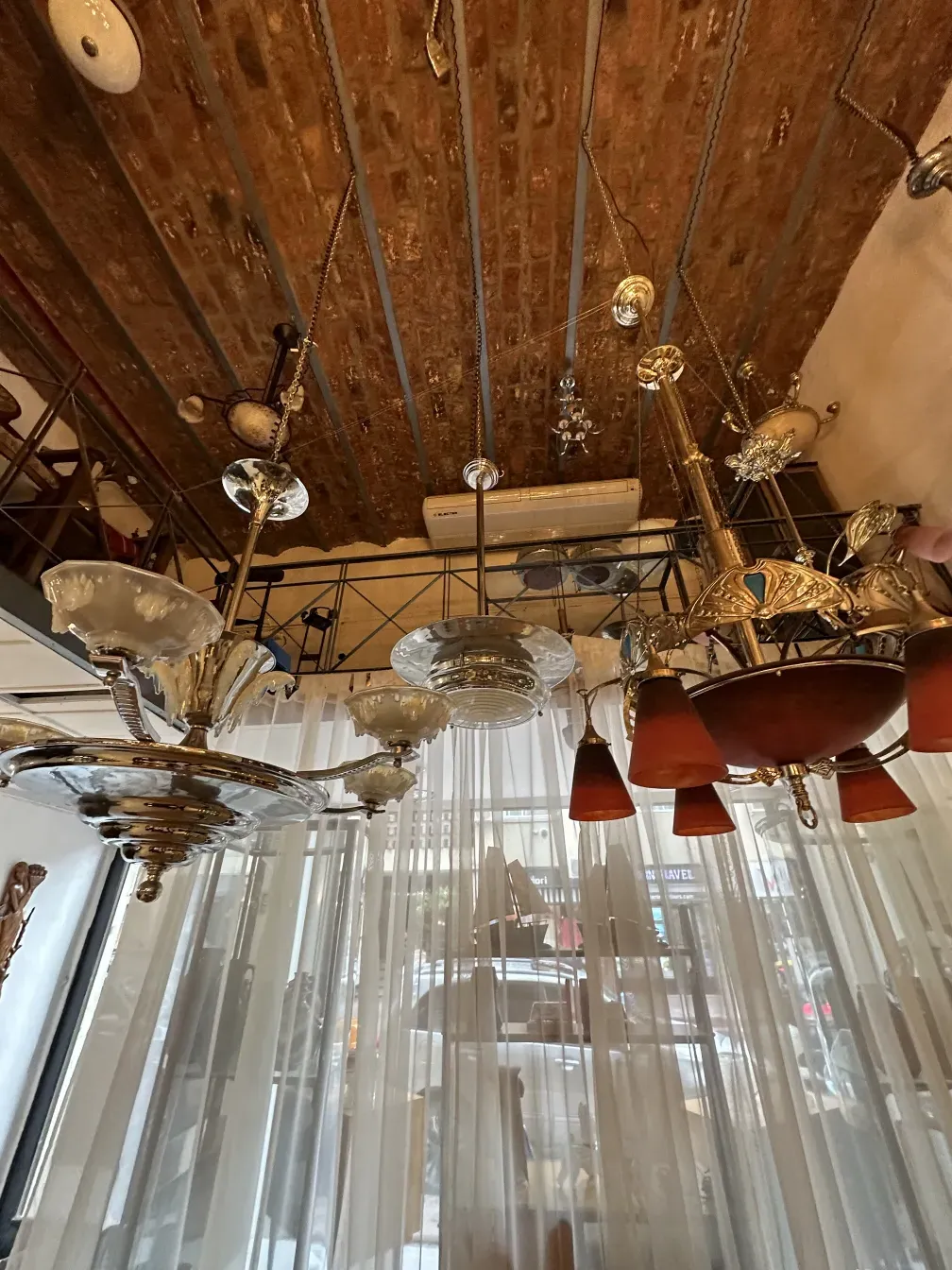 Antique hanging lamp with shiny decorative features