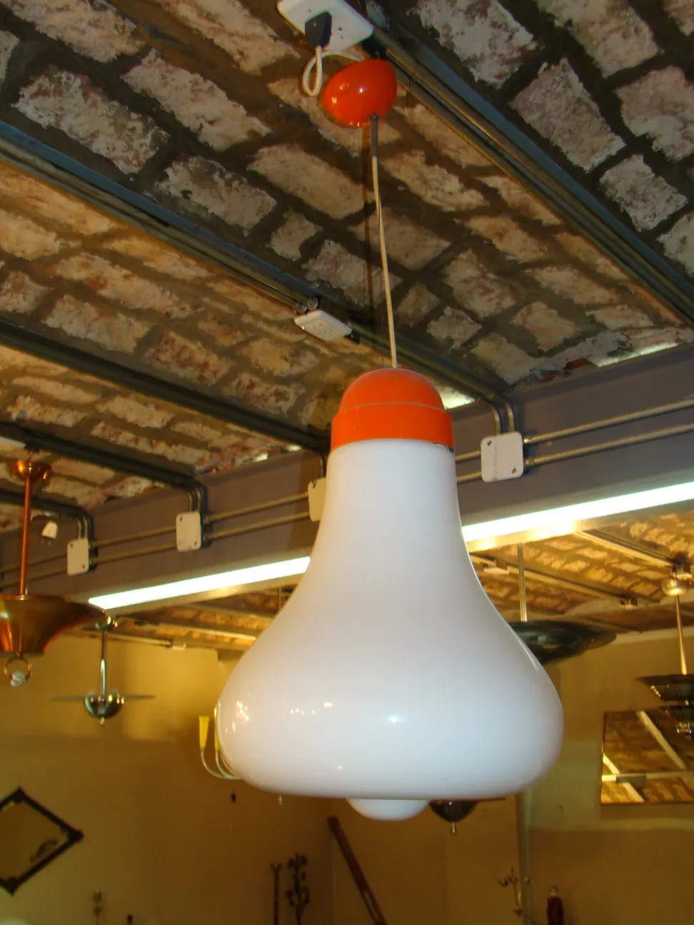 Antique hanging lamp in white and orange colors.
