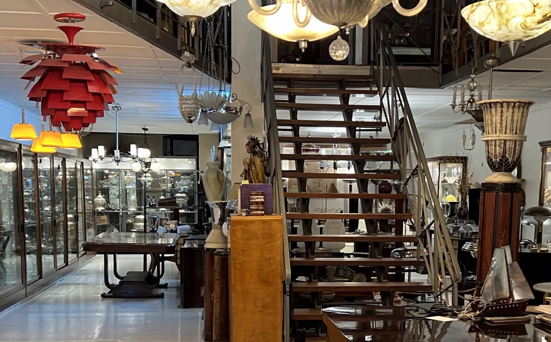 Antique hanging lamp in red color in an antiques setting.