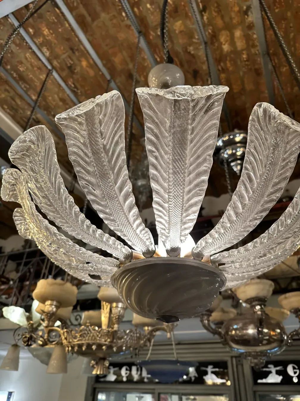 antique hanging lamp with leaf-shaped design, warm ambiance.