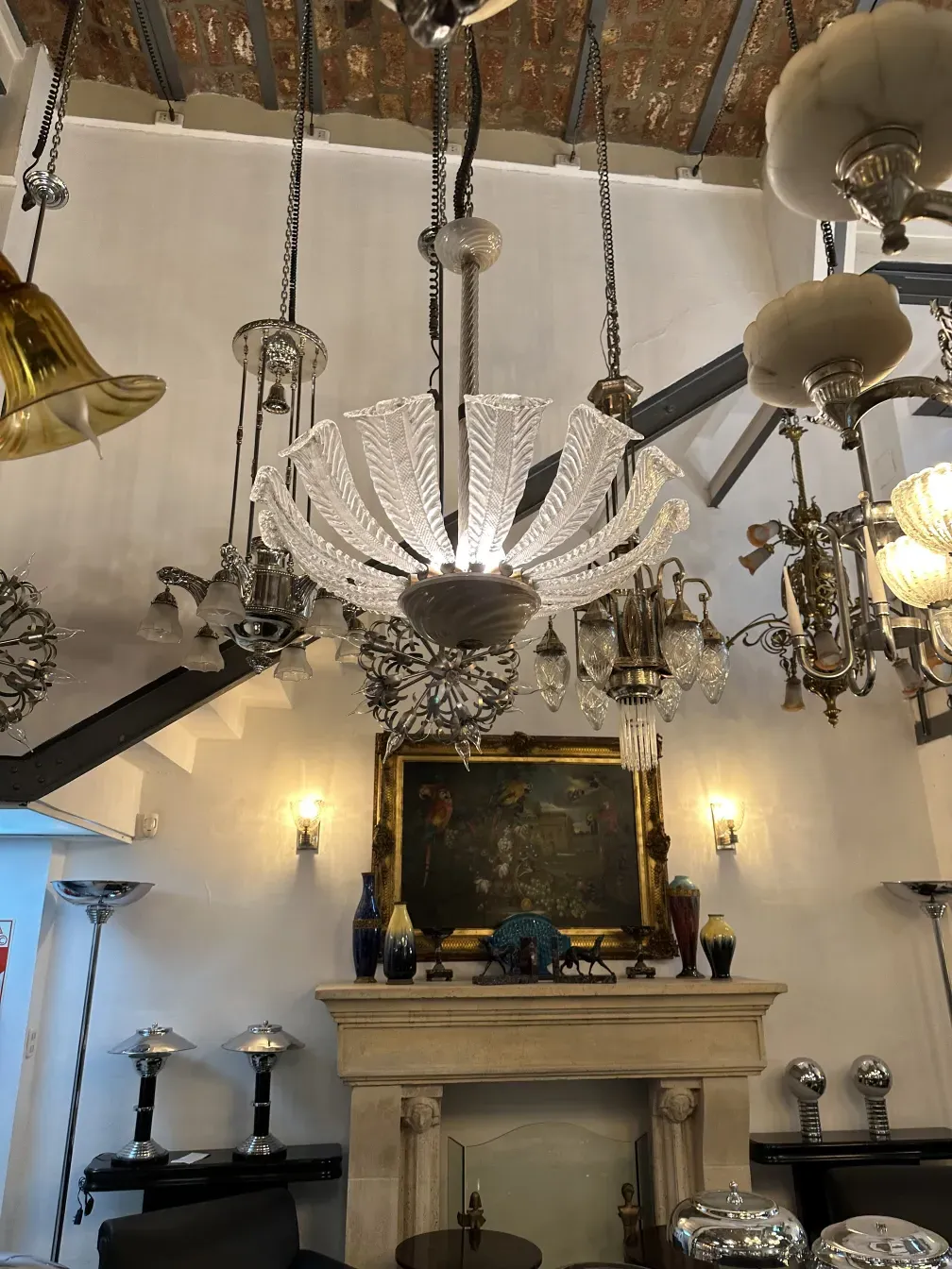 Antique hanging lamp by Paolo Venini with elegance, in a room with other antiques.