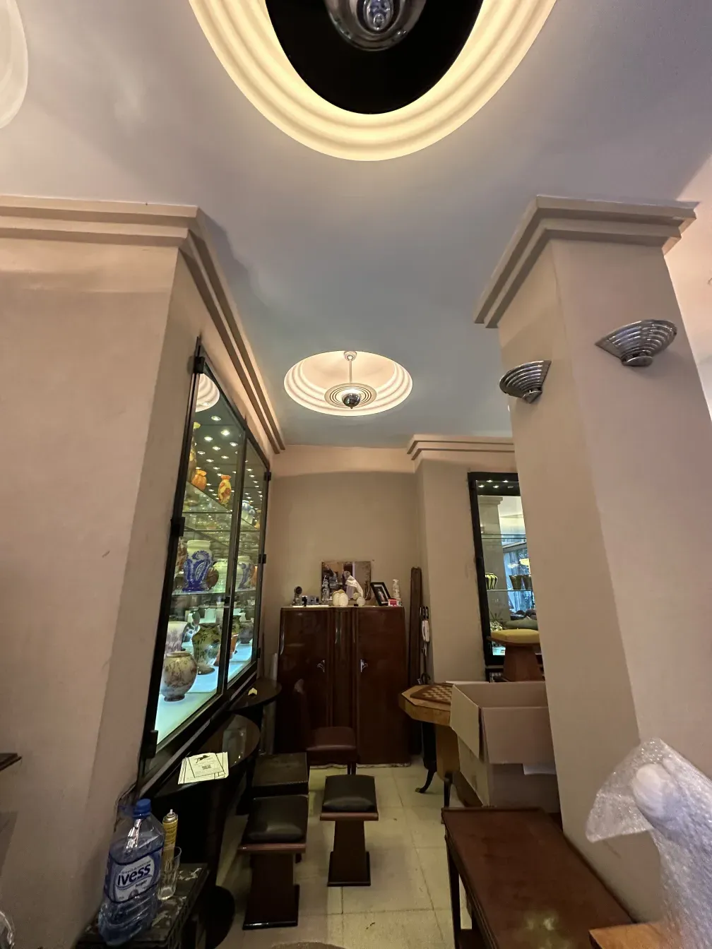 Antique hanging lamp in a cozy setting with wooden details.