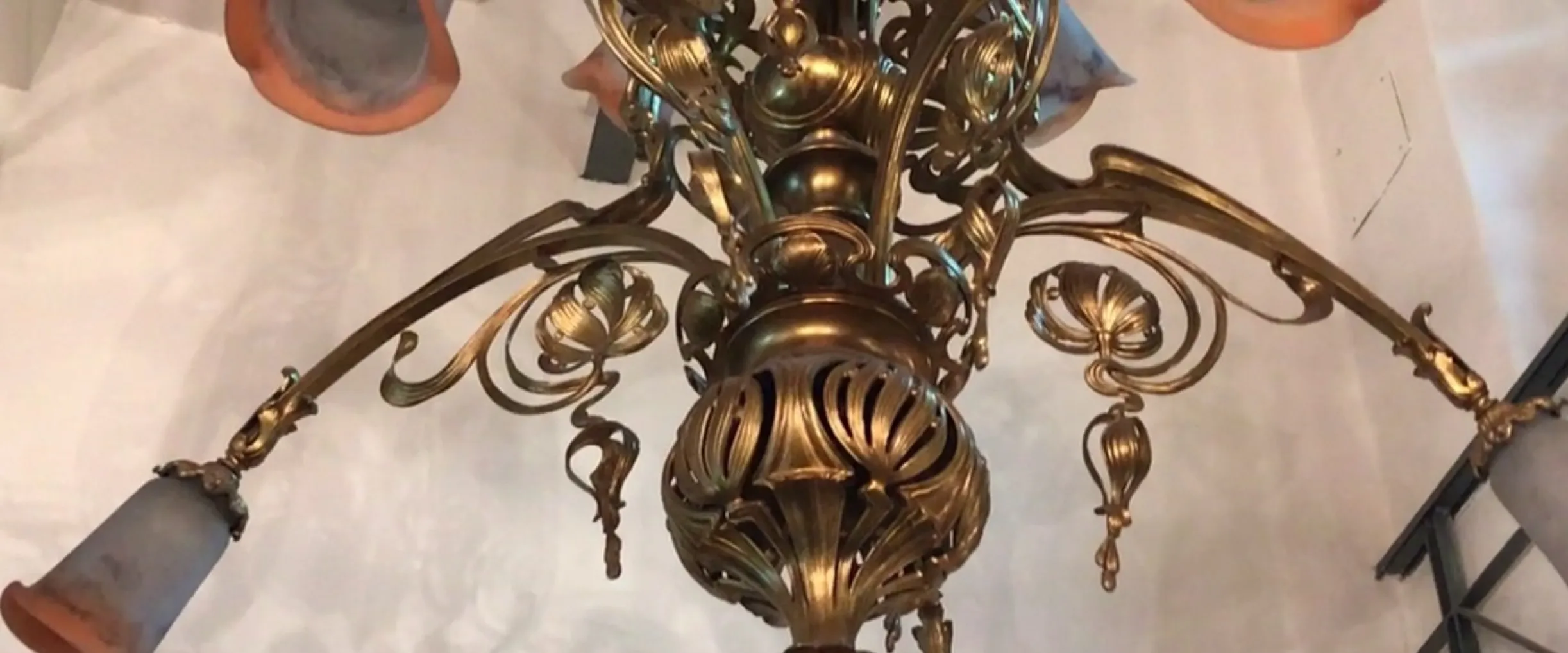 antique hanging lamp with decorative details and lights