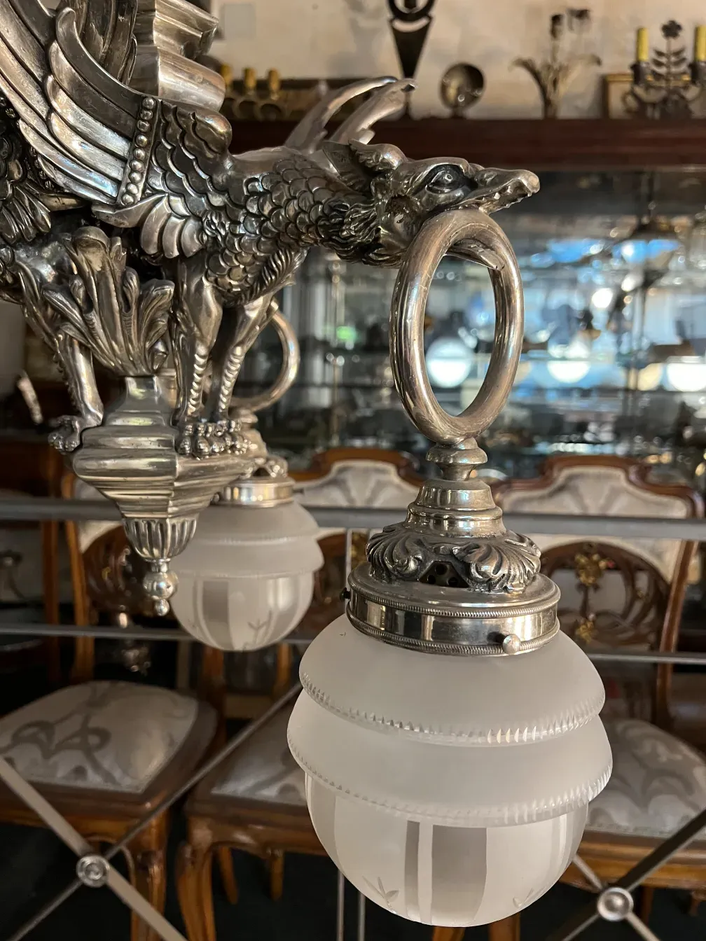 Antique hanging lamp with gold designs in the background