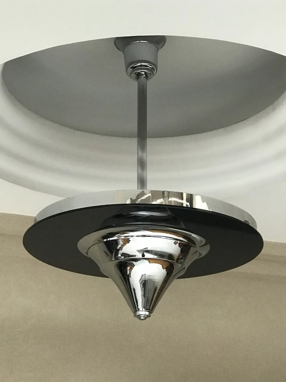 Antique hanging lamp with shiny design, unique decor.