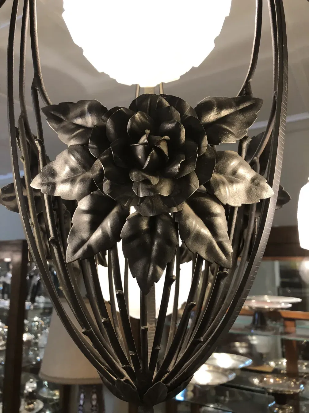Antique hanging lamp featuring rose design