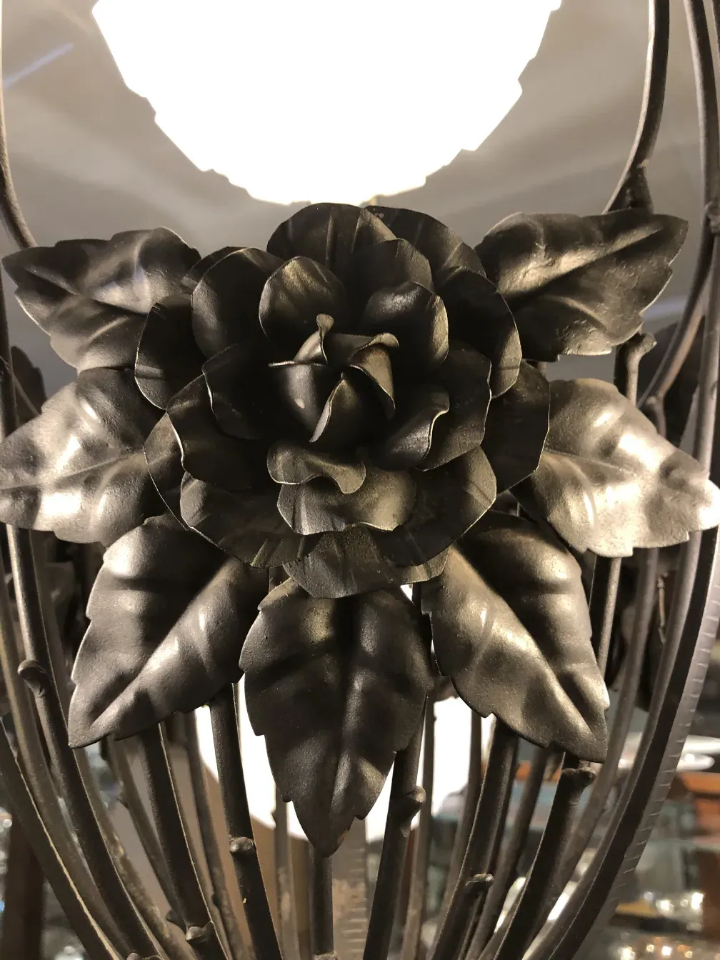 Antique hanging lamp featuring a flower design