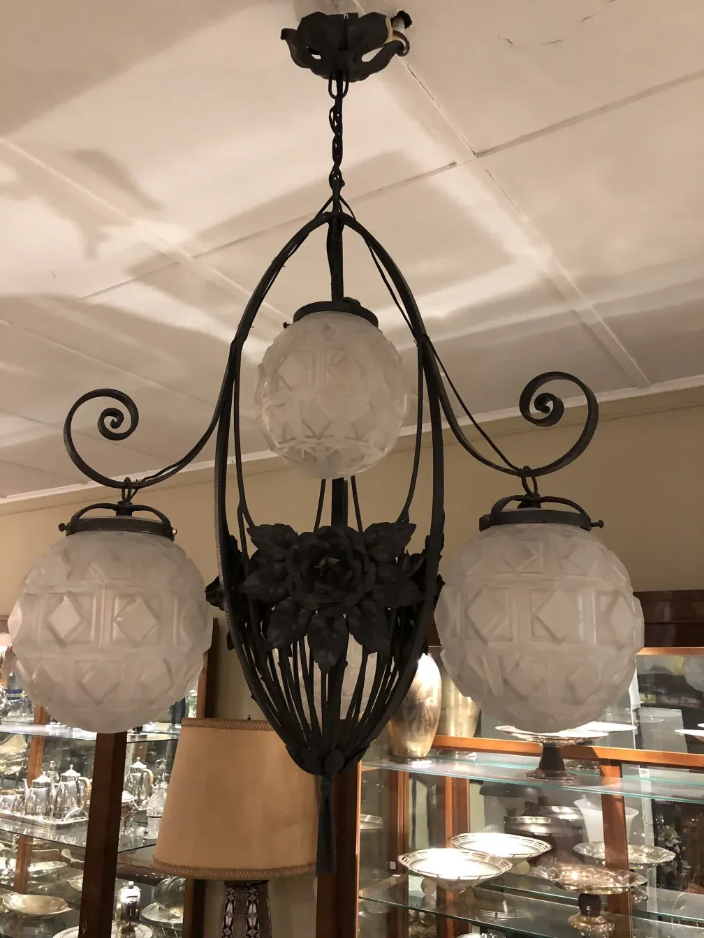 Antique hanging lamp with romantic details, three lights, decorative glass.