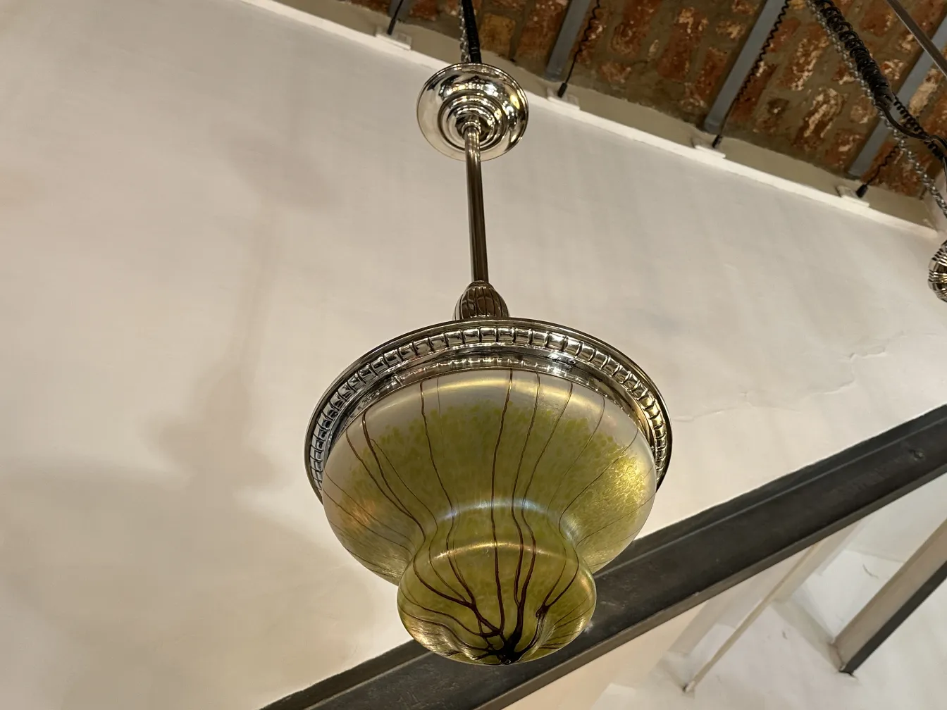 Antique hanging lamp with decorative glass and subtle details