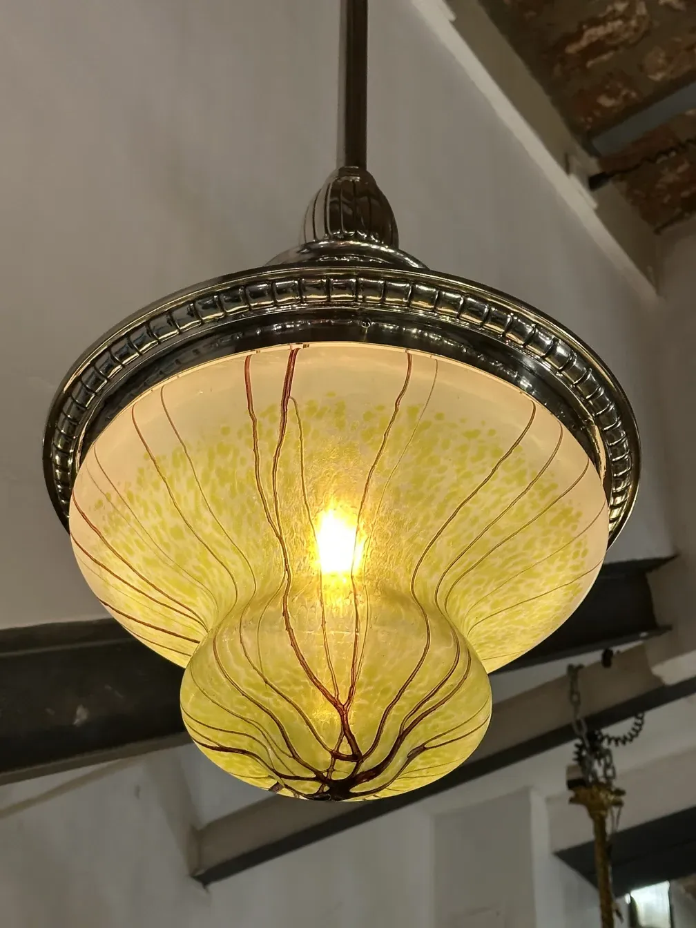 Antique hanging lamp with yellow design and lines
