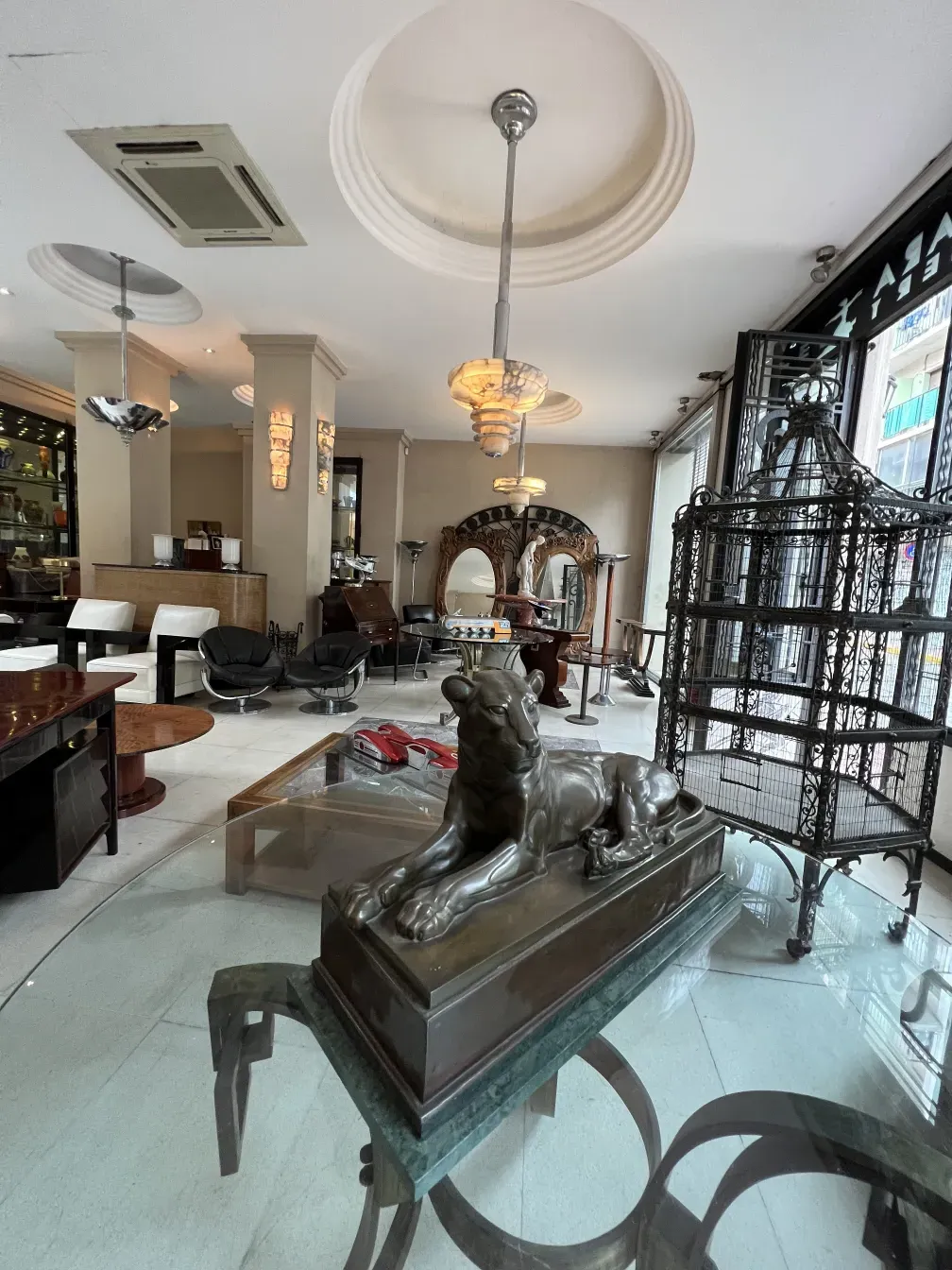 Antique hanging lamp with elegant design and intricate details in a cozy environment.