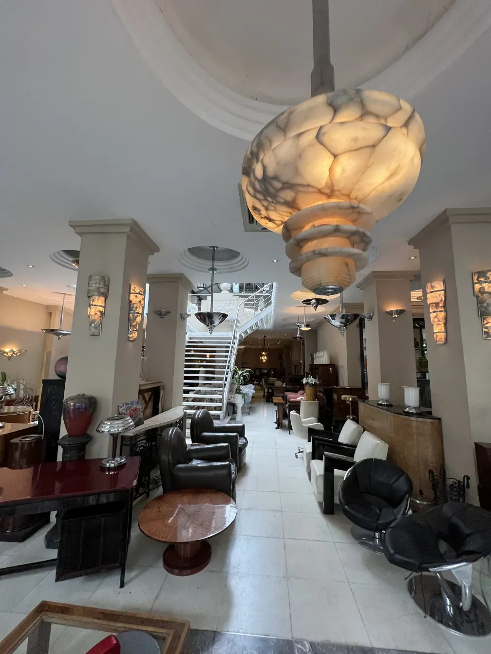 Antique hanging lamp with rounded shape illuminating a living room