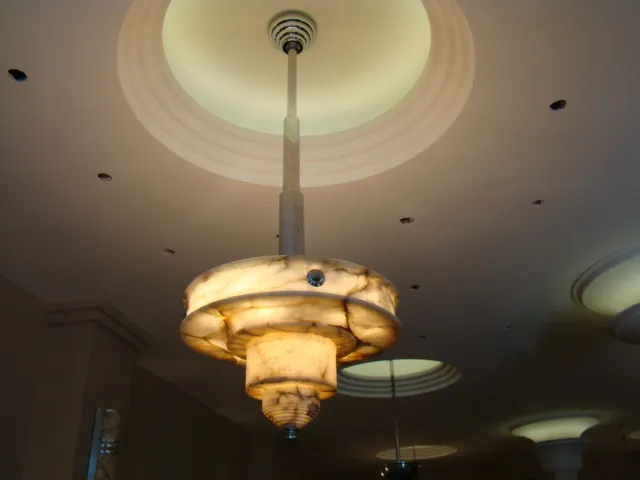 Antique hanging lamp with classic design in an elegant setting.