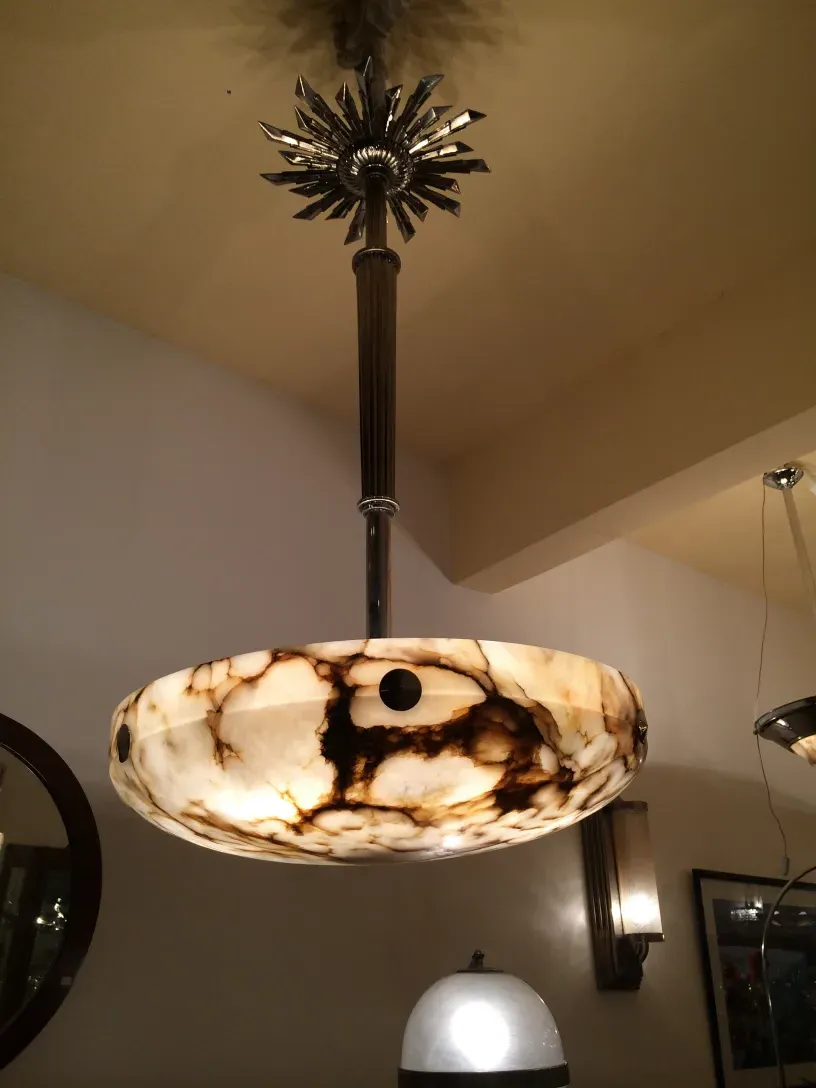 Antique hanging lamp with a unique design, set in a cozy environment.
