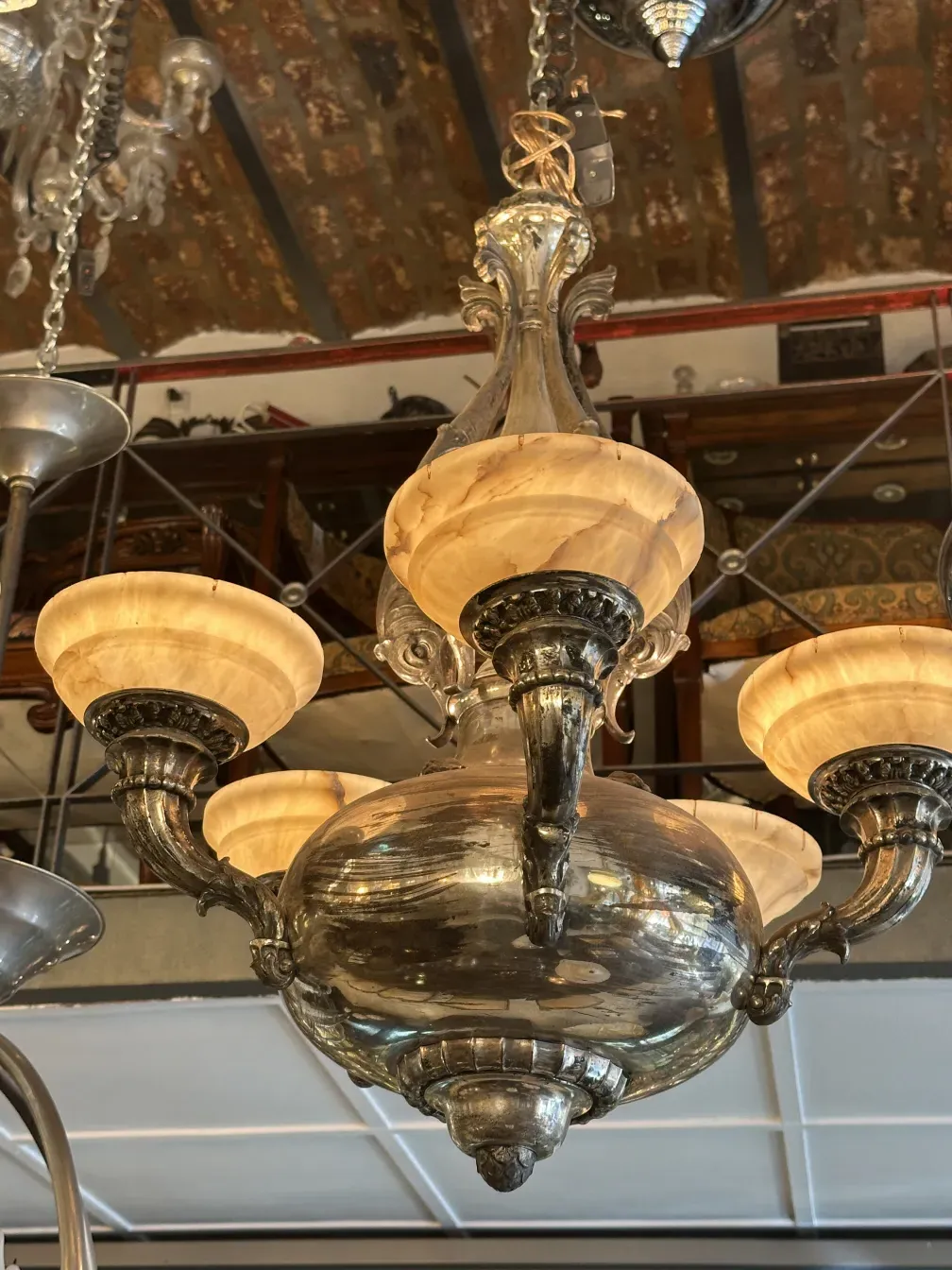 Antique hanging lamp with glass shades in a cozy setting
