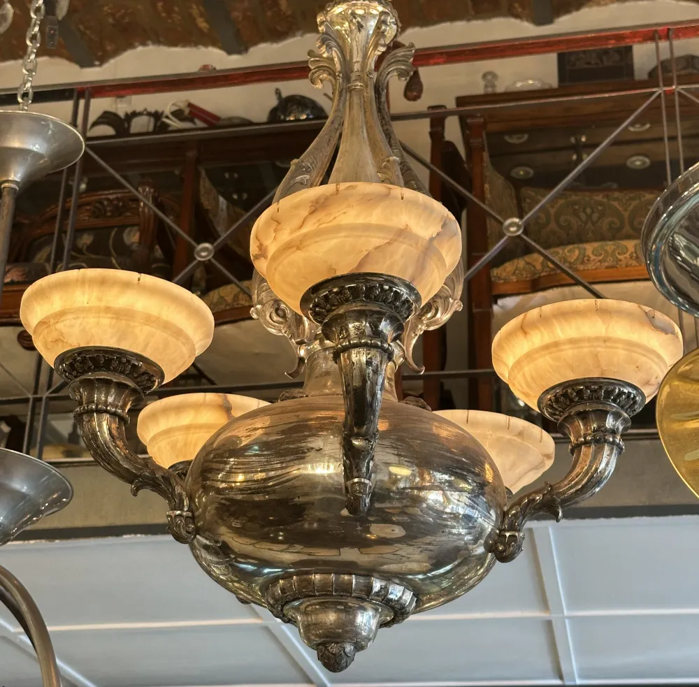 Antique hanging lamp with warm lights in a cozy setting.