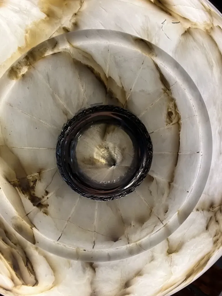 Top view of an antique hanging lamp with elegant design, warm ambiance.