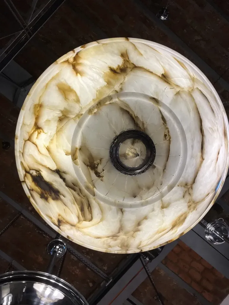 Antique hanging lamp with an elegant design, illuminating a modern space