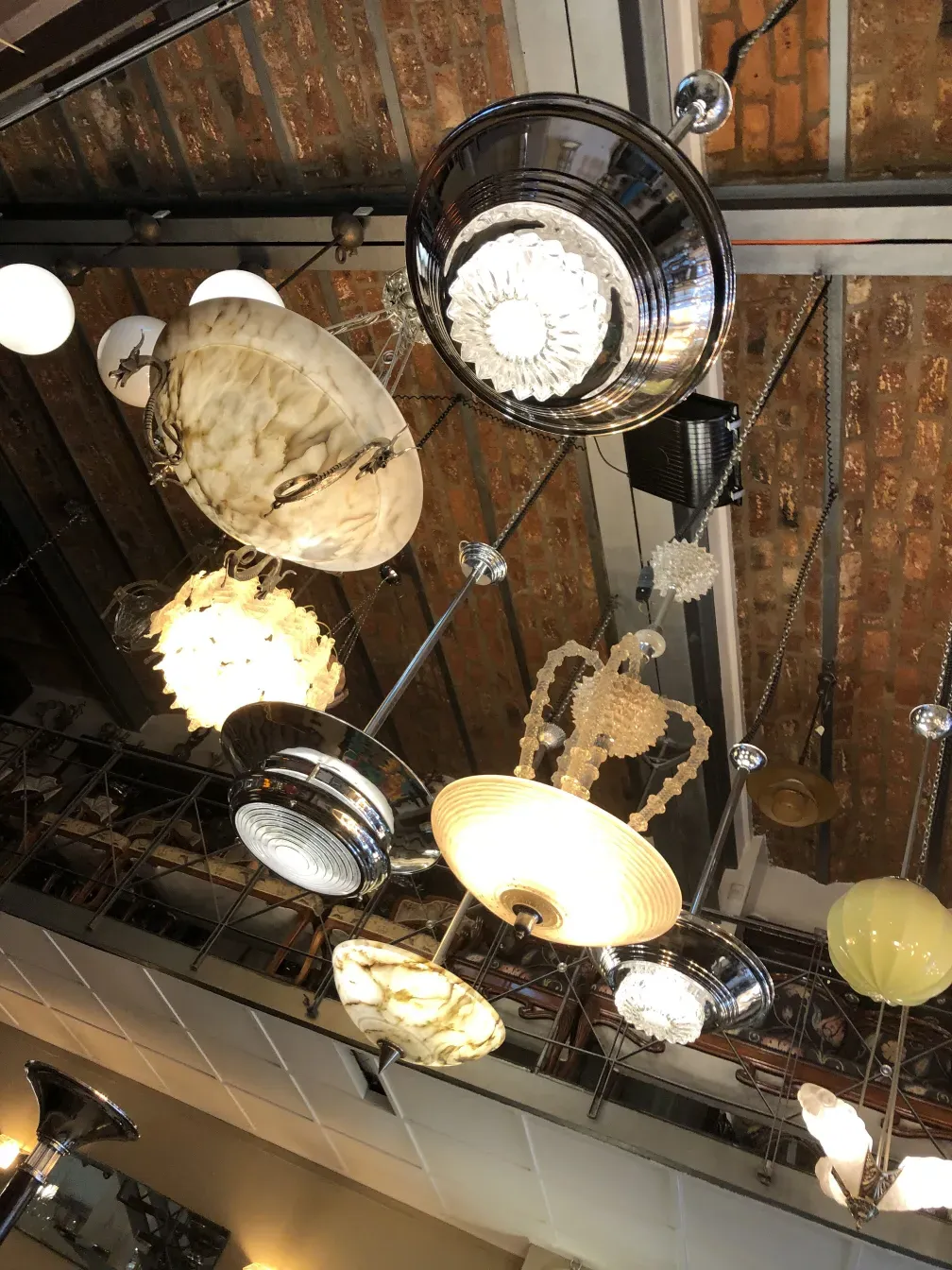 Antique hanging lamps in various styles in a cozy setting.