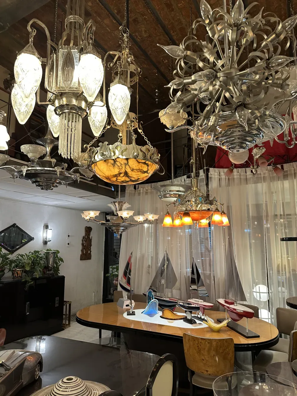 Beautiful antique hanging lamp with crystal and metal details in a modern setting.