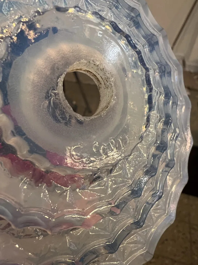 view of an interior with an antique hanging lamp Leleu, circular and decorative