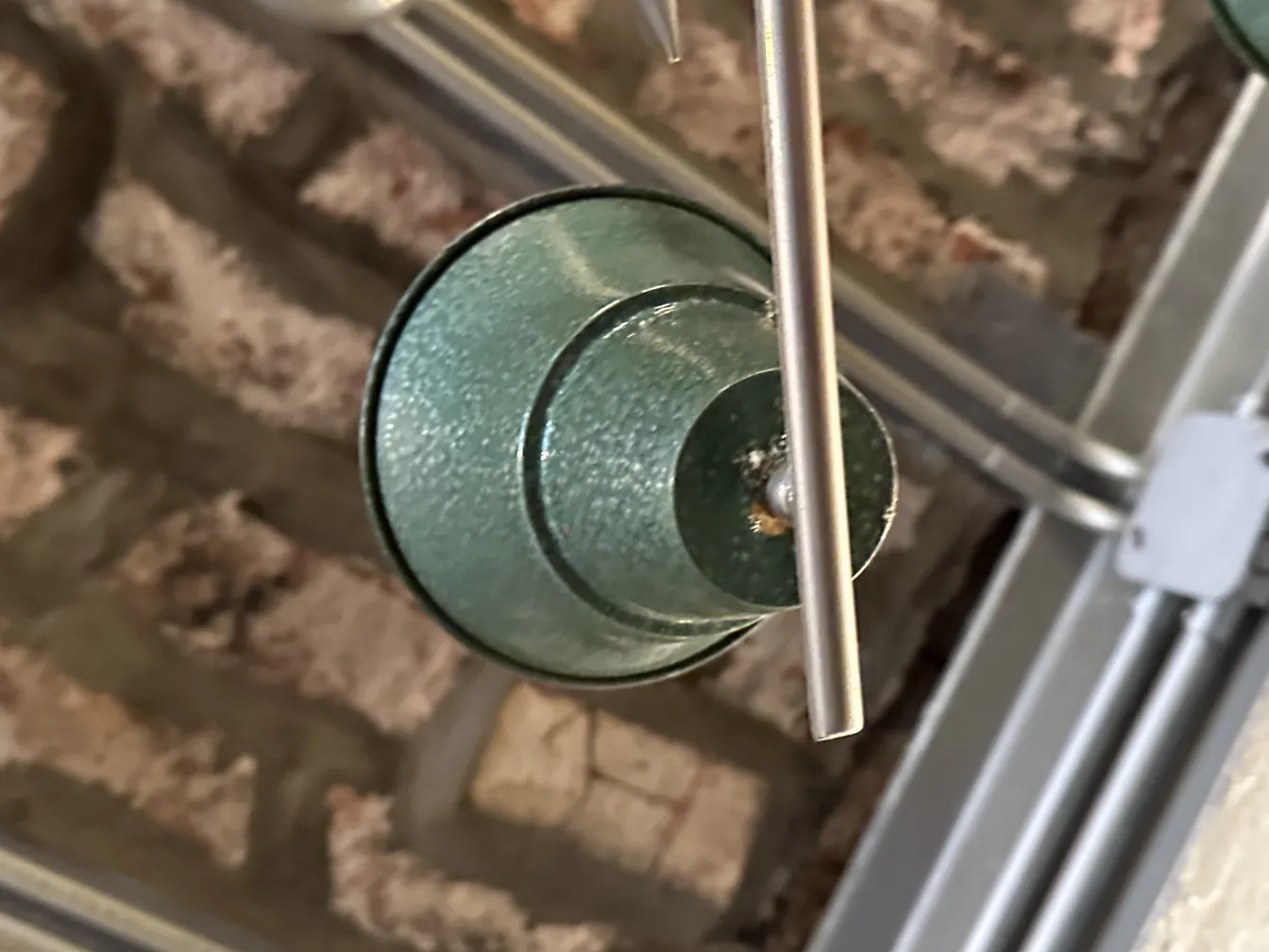 antique glass hanging lamp in a rustic setting