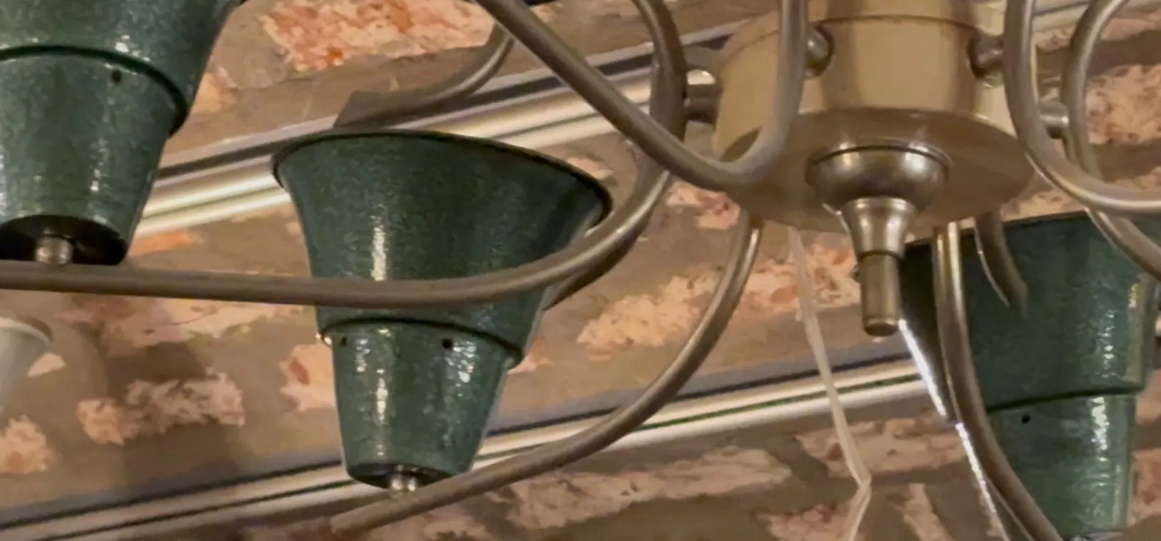 Vintage hanging lamp with artistic design in green and beige colors.