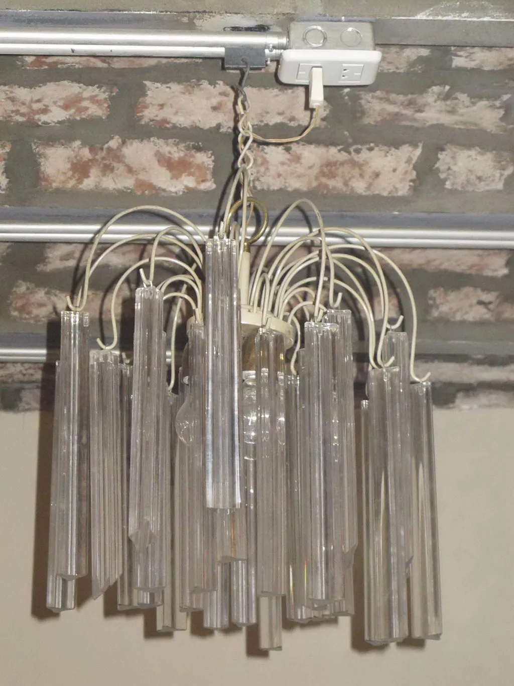 Antique hanging lamp with strings, ambient light in home.