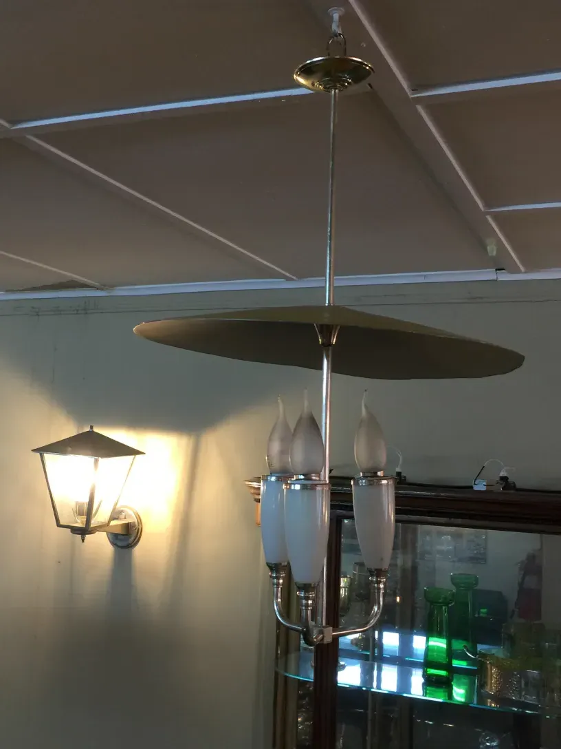 Antique hanging lamp with two lights and illuminated background