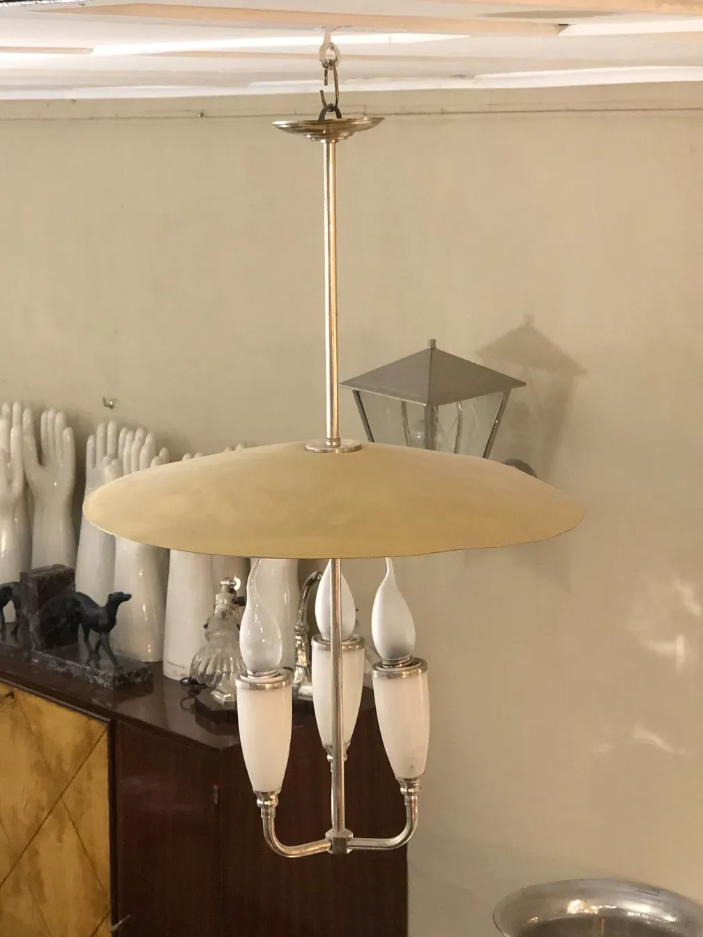 Antique hanging lamp with elegant arms and details.