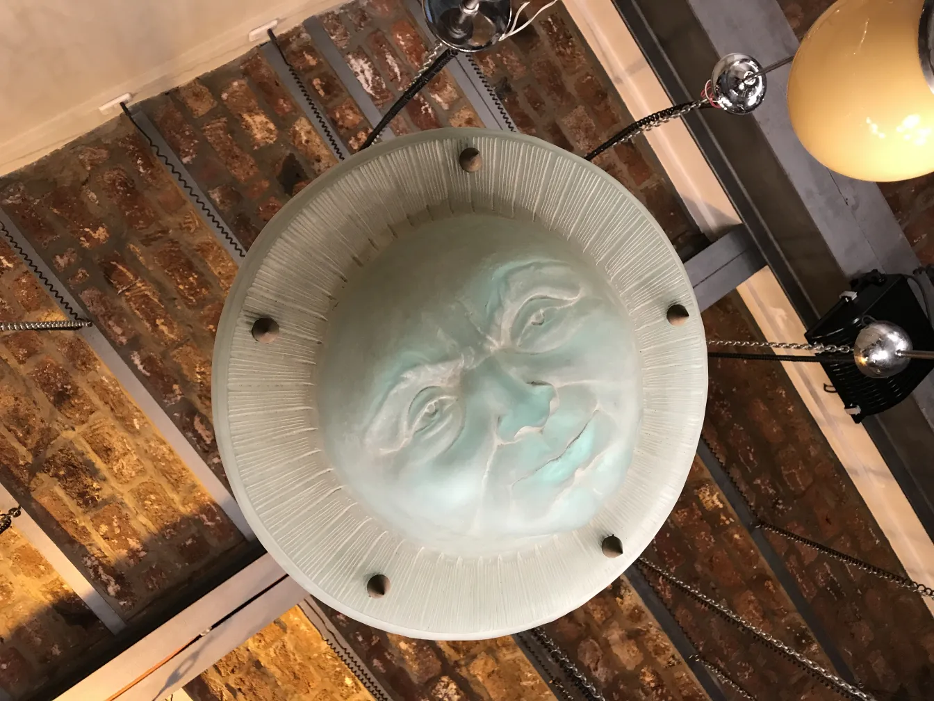 hanging lamp with human face st louis, cozy surroundings