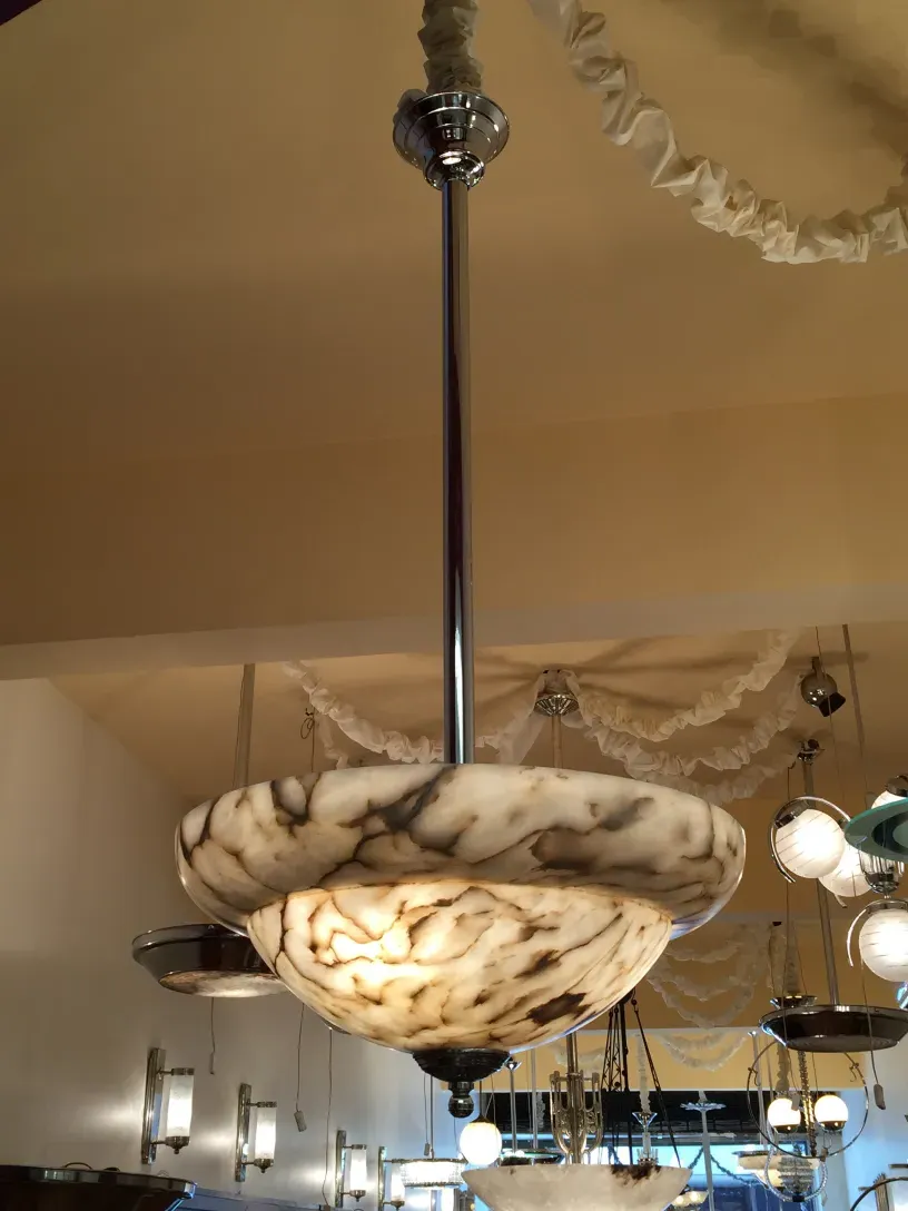 Antique hanging lamp made of marble with a glossy finish.