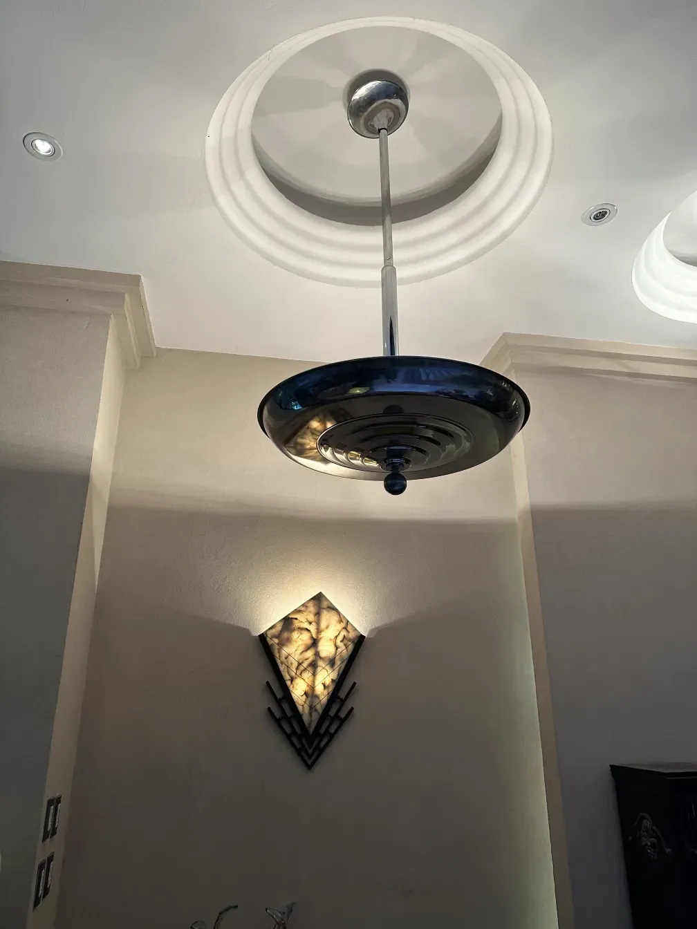 Antique hanging lamp with a shiny design in the setting