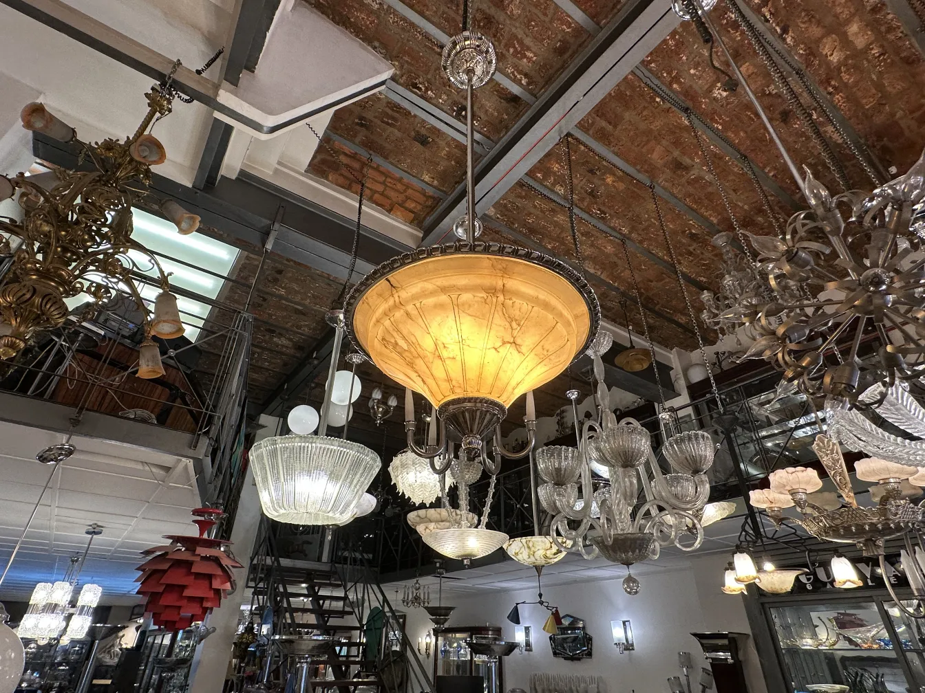 Antique hanging lamp with an elegant design, illuminating an artistic space.