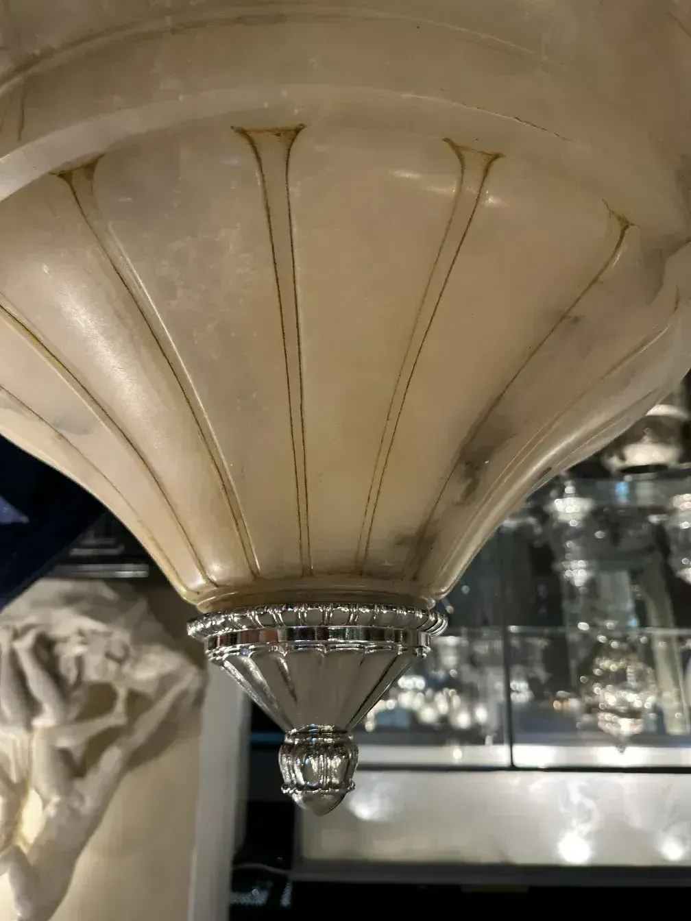 Antique hanging lamp made of alabaster with silver details.