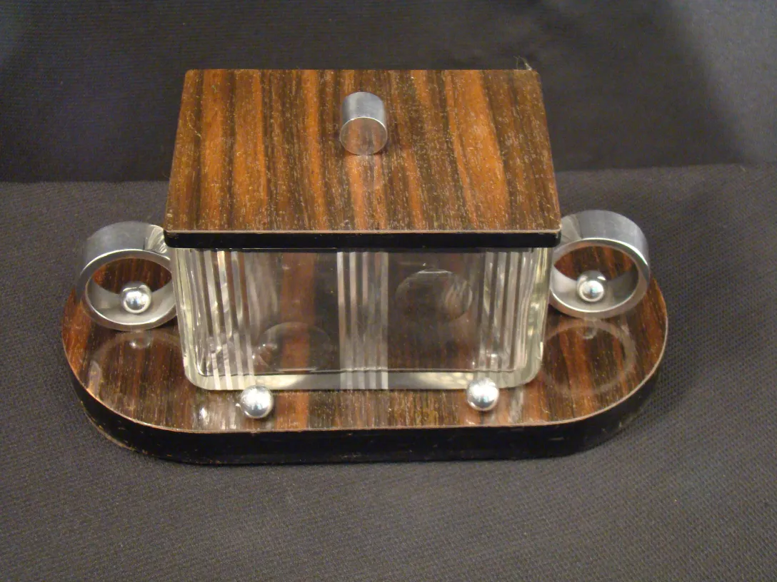 Antique translucent box with lid and metallic details.