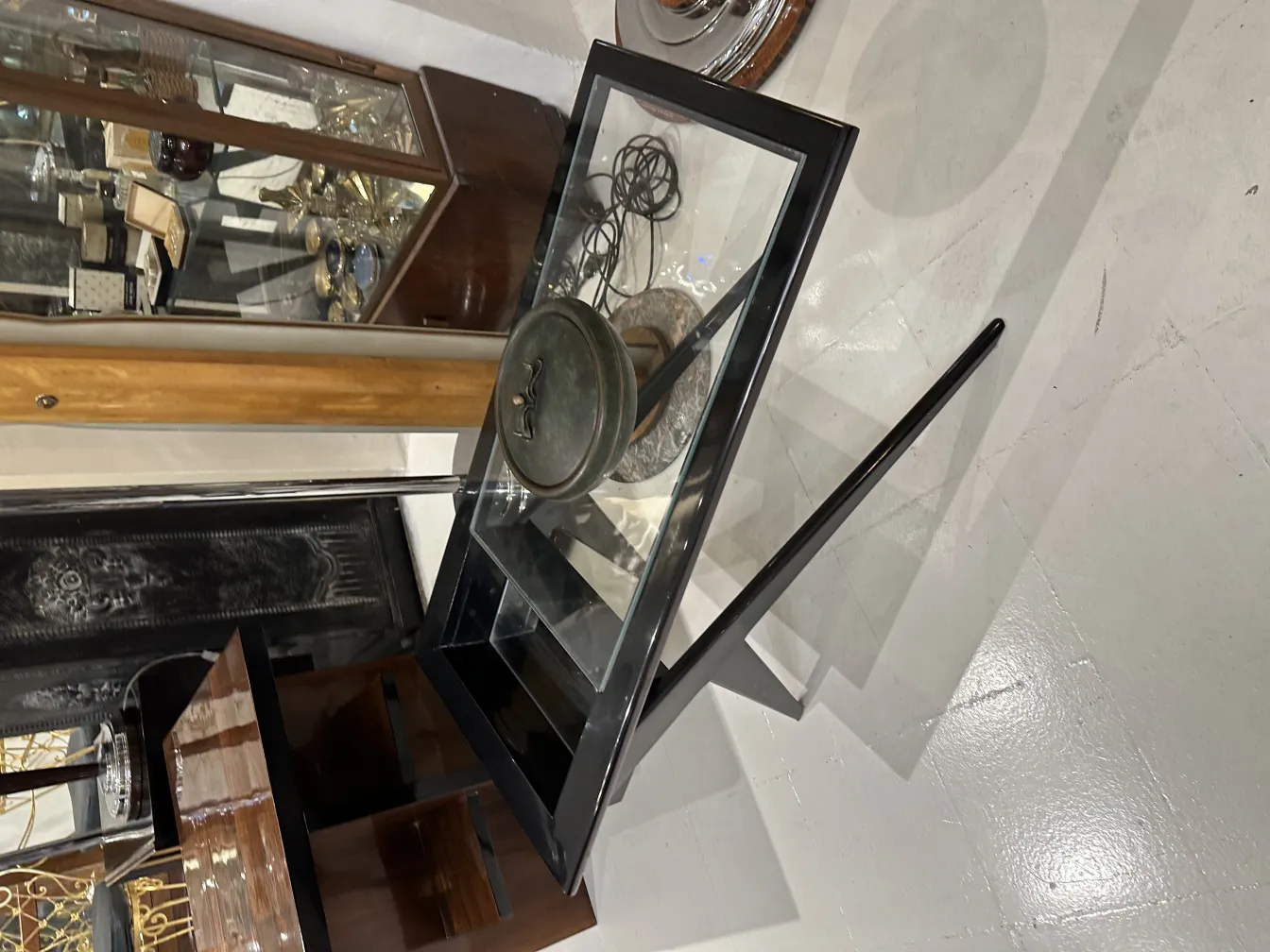 Antique collection box displayed in a showcase.