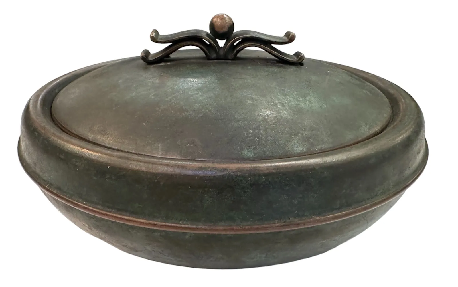 Round antique box with a spiral decorative lid.
