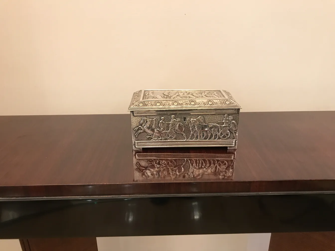 Antique box decorated with cavalry scenes.