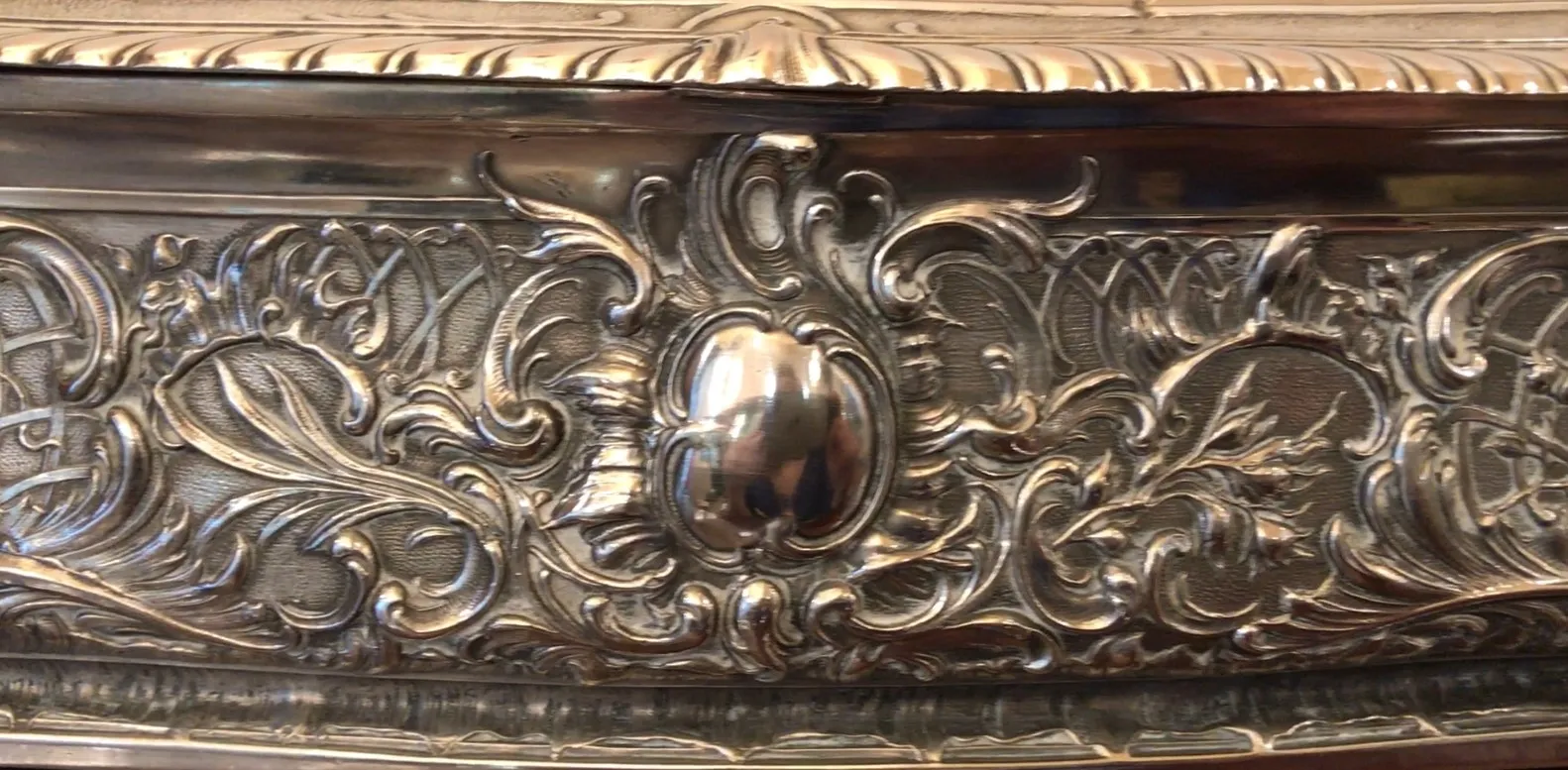 Antique box with intricate surface decorations.