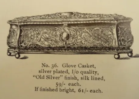 Antique box intricately designed, perfect for gloves.