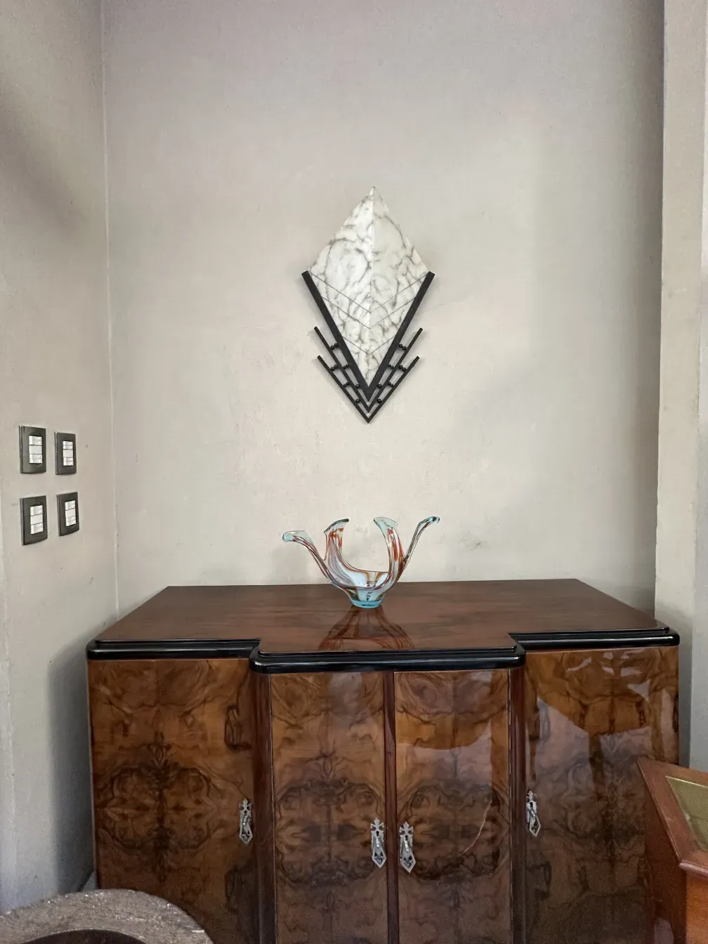 Antique sideboard with a glossy finish and elegant adornments