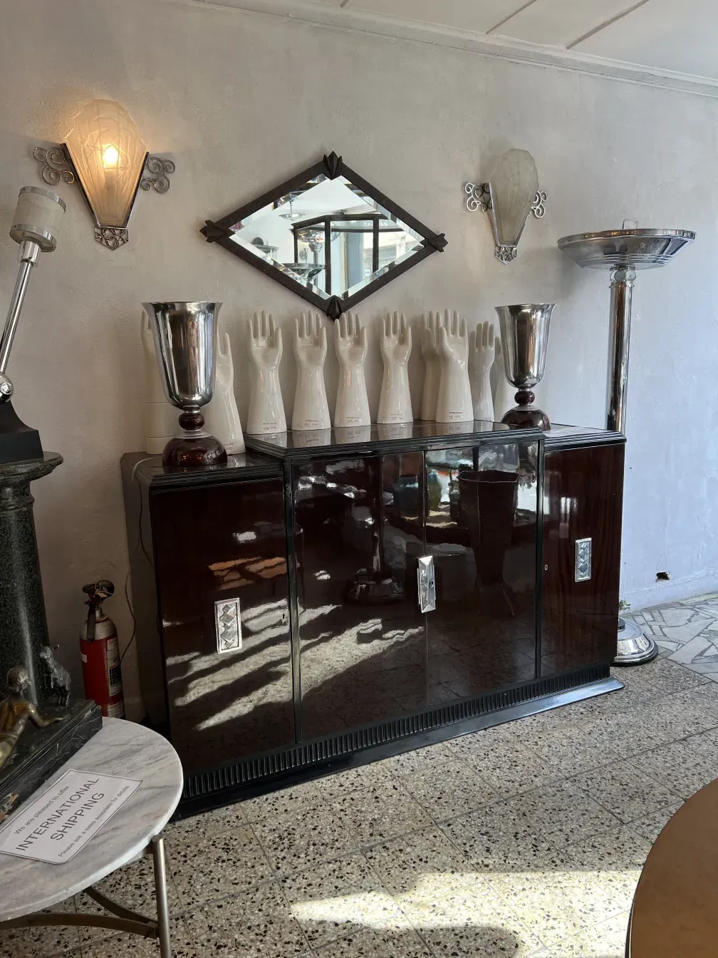 Antique sideboard with a shiny surface, surrounded by decor