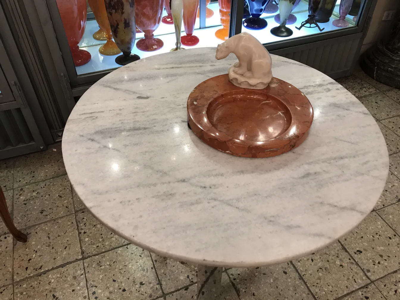 Antique standing ashtray on an elegant table, decorative