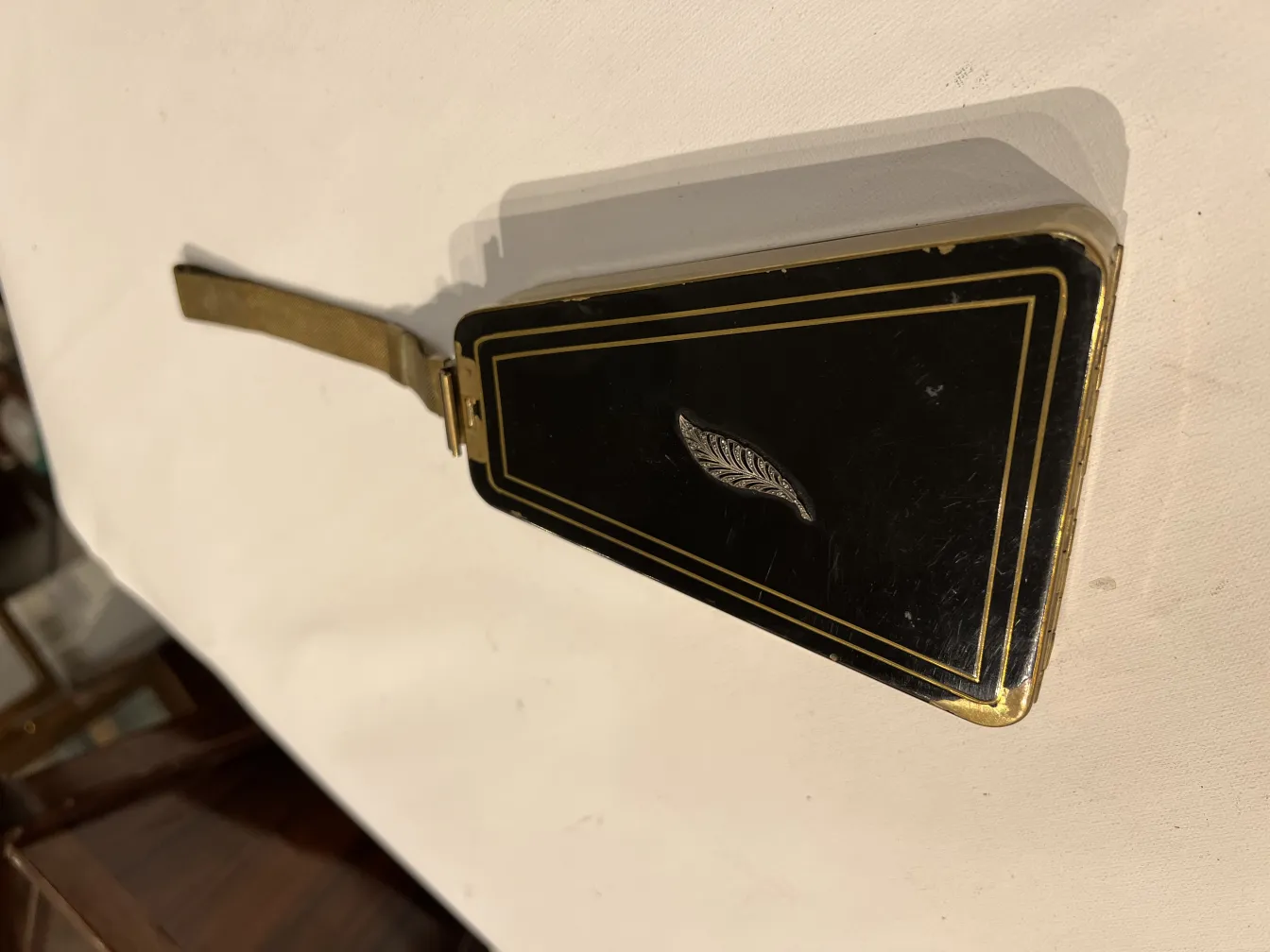 antique black bag art deco with gold design and leaf