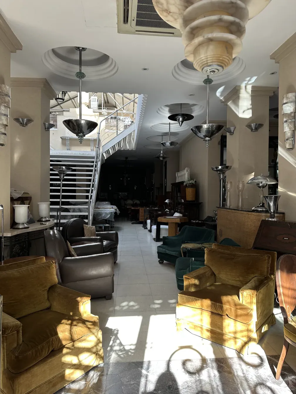 Two antique hanging lamps with elegant design in a cozy setting.